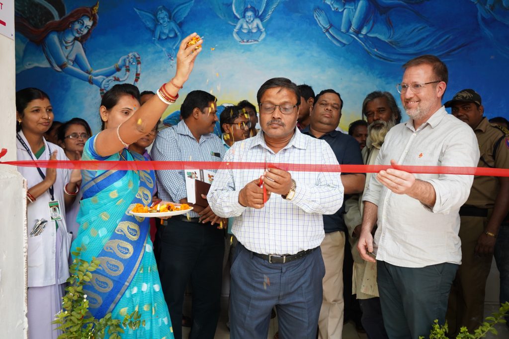 Celebrations showing the cutting of a red ribbon to open the Odisha Lab.Our Ward centre in India.