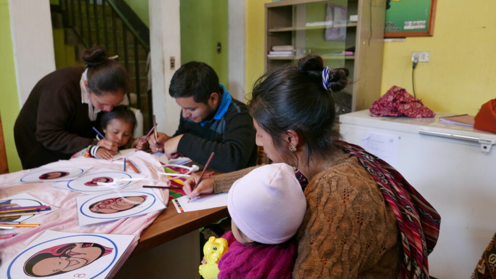 Family participates in a workshop to co-create an improved group antenatal care model in Guatemala